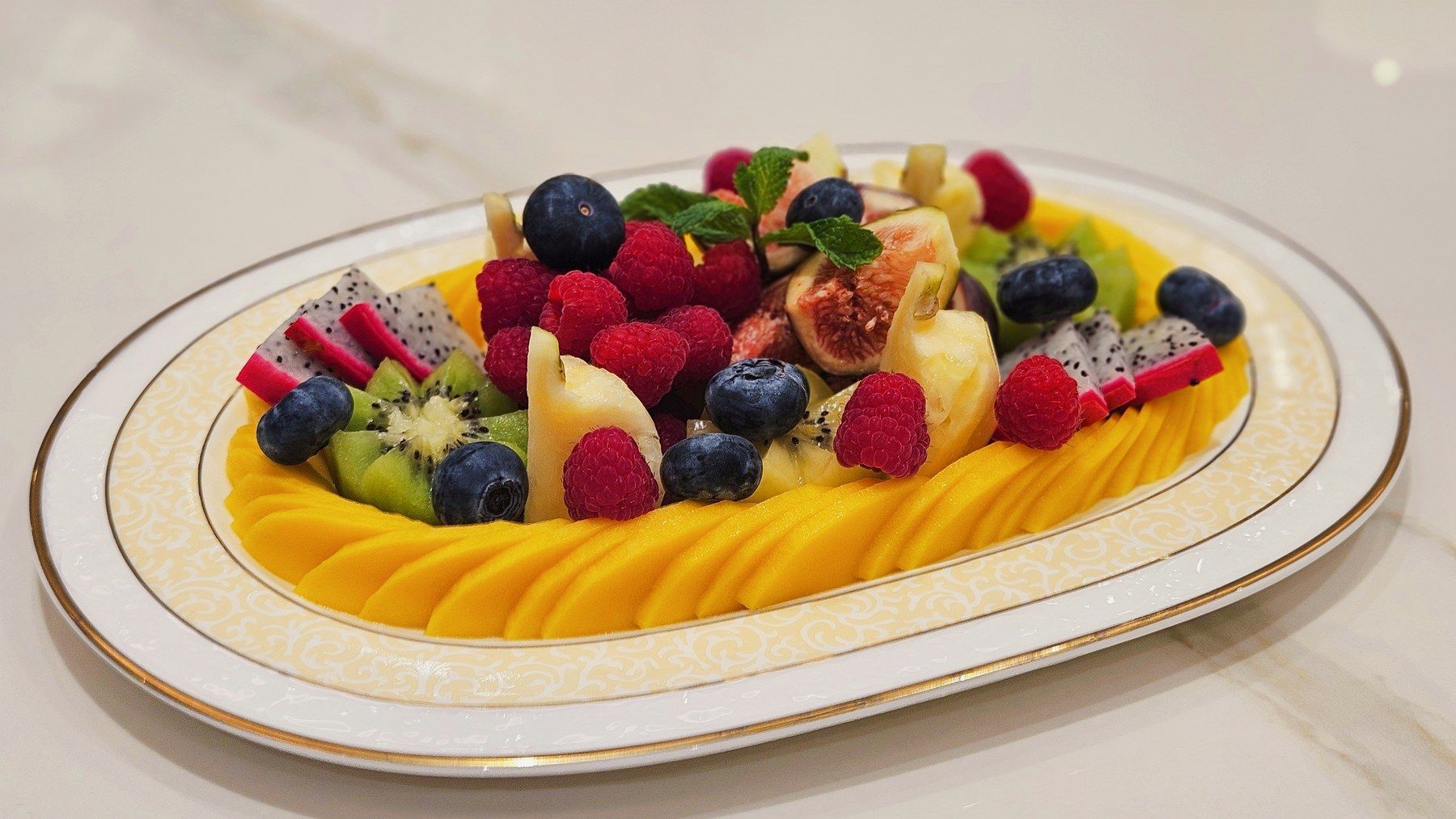 Fresh-fruit platter: mango, berries, kiwi and dragon fruit.
